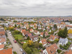 Quiet residential area in autumn seen from above under grey skies, Metzingen, Germany