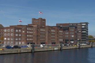Former warehouse in the port of Kiel, apartments, services, red brick building, architecture, quay,