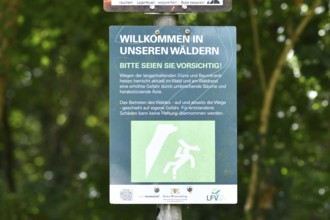 Mannheim, Germany - August 31st 2025: Warning sign at entrance of Dossenwald forest about danger of
