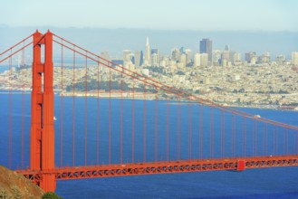 View of Golden Gate Bridge and financial district in the distance, San Francisco, California, USA