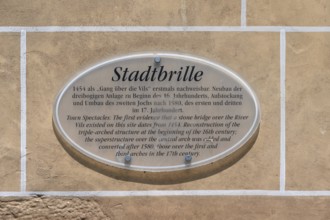 Informnation sign on city glasses, late medieval water gate building over the Vils, Amberg, Upper