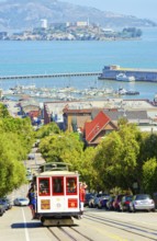 Powell-Hyde line cable car with Alcatraz Island in the background, San Francisco, California, USA