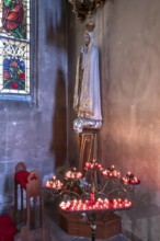 Sacrificial candles with Saint Mary, St. Martin Church, Amberg, Upper Palatinate, Bavaria, Germany