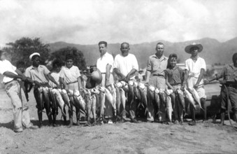 Sport fishermen present their catch, mostly mackerel, around 1925, Acapulco de Juárez, Mexico