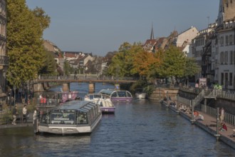 Tourist boat docks on the Ill and transports visitors who enjoy the view of Strasbourg's sights and