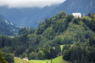 Schöllanger Castle Church, back left ski jumping hills of the Orlen Arena in Oberstdorf,