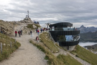 Nebelhorn summit with summit cross and summit restaurant, back right summit of Hochvogel,