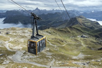 View from Nebelhorn summit to Nebelhorn cable car cabin, mountains of the Allgäu Alps behind,