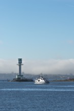 Green-white lighthouse Friedrichsort with city panorama of the state capital, Kiel Fjord, Kiel,
