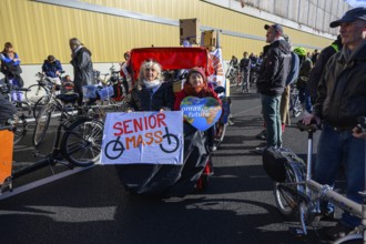 Senior women from Senior Mass and Grandmas for Future in bicycle rickshaw on A100 at a demo on the