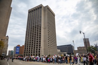 Detroit, Michigan USA - 18 October 2025 - A large crowd marched past the Federal Building during a