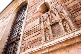 Medieval building facade in the historic center of Verona. Verona, Province of Verona, Italy. 10.12