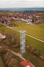 A tower offers a wide view of a village and surrounding fields in autumn colors, Dürrenmettstetten