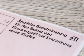 Close-up of a medical certificate for receiving sickness benefit if the child is ill
