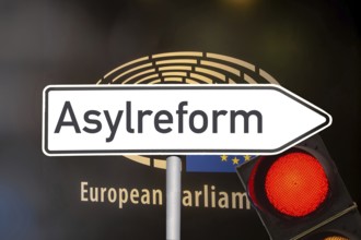 (photo montage) Directional arrow with the inscription ASYLUM REFORM in front of the European Union
