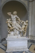 Photo of original ancient marble sculpture Laocoon group of priests Laocoon and his sons fighting