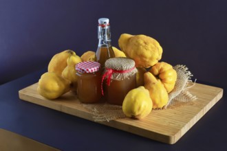 Still life with quinces, homemade quince jelly and quince liqueur, autumn, Germany