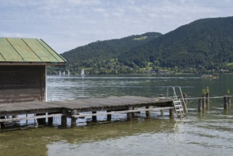 Hut and jetty on the banks of Tegernsee, Bad Wiessee, Upper Bavaria, Bavaria, Germany