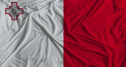 Maltese flag with fabric texture background. National flag of Malta with cloth texture