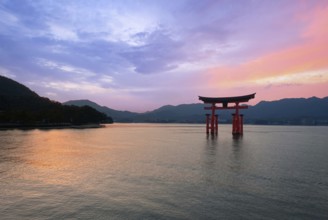 Japan, Miyajima, or Itsukushima, a semirural island with an iconic floating shrine with a giant red