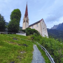 Late Gothic Catholic parish church of Saints George and Nicholas from around 1500 with churchyard,