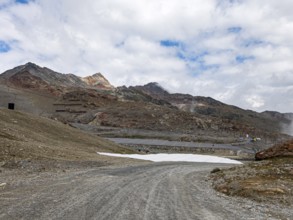 Alpine mountain landscape with covered snowfields at the valley station of the Tiefenbach cable car