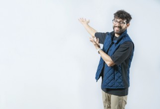 Smiling Handsome Man Presenting something isolated. Handsome guy welcoming you on isolated