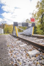 Rail end with barrier against autumn background and blue sky, ZOB Calw, Hermann Hessebahn, Calw,