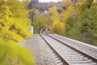 Railway barrier at the end of the tracks surrounded by autumn nature, ZOB Calw, Hermann Hessebahn,