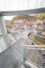 Glass staircase with view of autumnal town and hilly landscape, ZOB Calw, Hermann Hessebahn, Calw,
