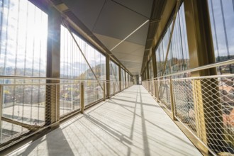 Modern footbridge with sun rays and shadows through the grid, ZOB Calw, Hermann Hessebahn, Calw,