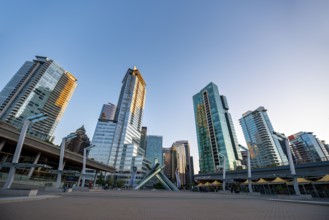 Olympic Cauldron Statue, Jack Poole Plaza Square, skyscrapers on the promenade at sunset, Coal