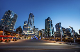 Illuminated skyscrapers on the promenade in the evening, Olympic Cauldron Statue, Jack Poole Plaza