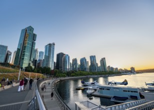 Seaplane Terminal, skyscrapers on the promenade at sunset, Coal Harbour, Vancouver, British