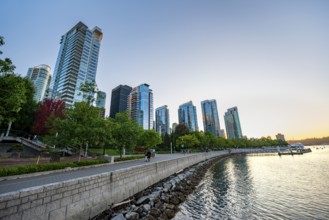 Skyscrapers on the promenade at sunset, Coal Harbour, Vancouver, British Columbia, Canada