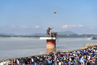 The Indian Air Force aerobatic team performs during an air show as part of the 93rd Air Force Day