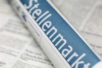 Symbolic image of the labor market in Germany: close-up of a newspaper with the text JOB MARKET