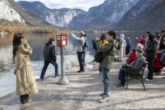 Tourists taking photos, Hallstatt, Upper Austria, Salzkammergut, Austria. 29.10.2025 < english>