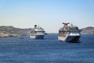 Mykonos, Cyclades, Greece - cruise ships CARNIVAL MIRACLE and COSTA FORTUNA are located in the bay