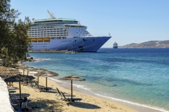 Mykonos, Cyclades, Greece - Voyager of the Seas cruise ship is located in Mykonos Harbour Bay.