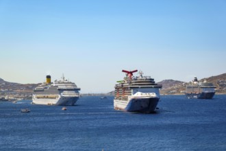 Mykonos, Cyclades, Greece - cruise ships CARNIVAL MIRACLE, COSTA FORTUNA and MEIN SCHIFF 5 are