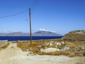 Mykonos, Cyclades, Greece - Barren landscape with street lamp on wooden pole, power pole, telephone
