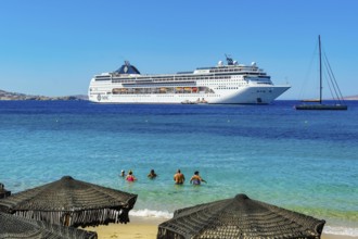 Mykonos, Cyclades, Greece - Cruise ship MSC Lirica is located in Mykonos Harbour Bay. Cruise ships