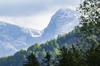 View into the mountains next to Lake Almsee on a rainy day in spring, Traunstein summit,
