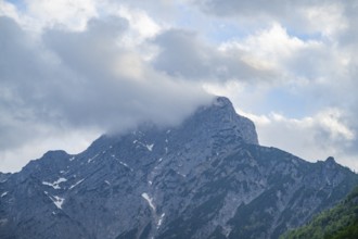 View into the mountains next to Lake Traunsee on a rainy day in spring, Traunstein summit,