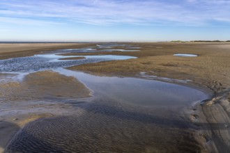 East beach of the East Frisian island of Spiekeroog, at low tide, tidal creek, watercourse at low