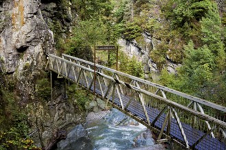 Wooden bridge over the mountain river Diosaz in the gorge, Gorges de la Diosaz, Les Houches,