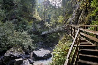 Wooden walkway over the Diosaz mountain river in the gorge, Gorges de la Diosaz, Les Houches,