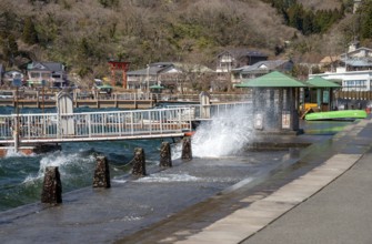 Water splashes on the waterfront of Lake Ashi in Motohakone, Hakone, Japan
