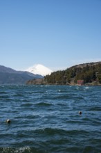 View of Lake Ashi with Mount Fuji volcano and peace torii from Hakone Shrine, Hakone, Japan